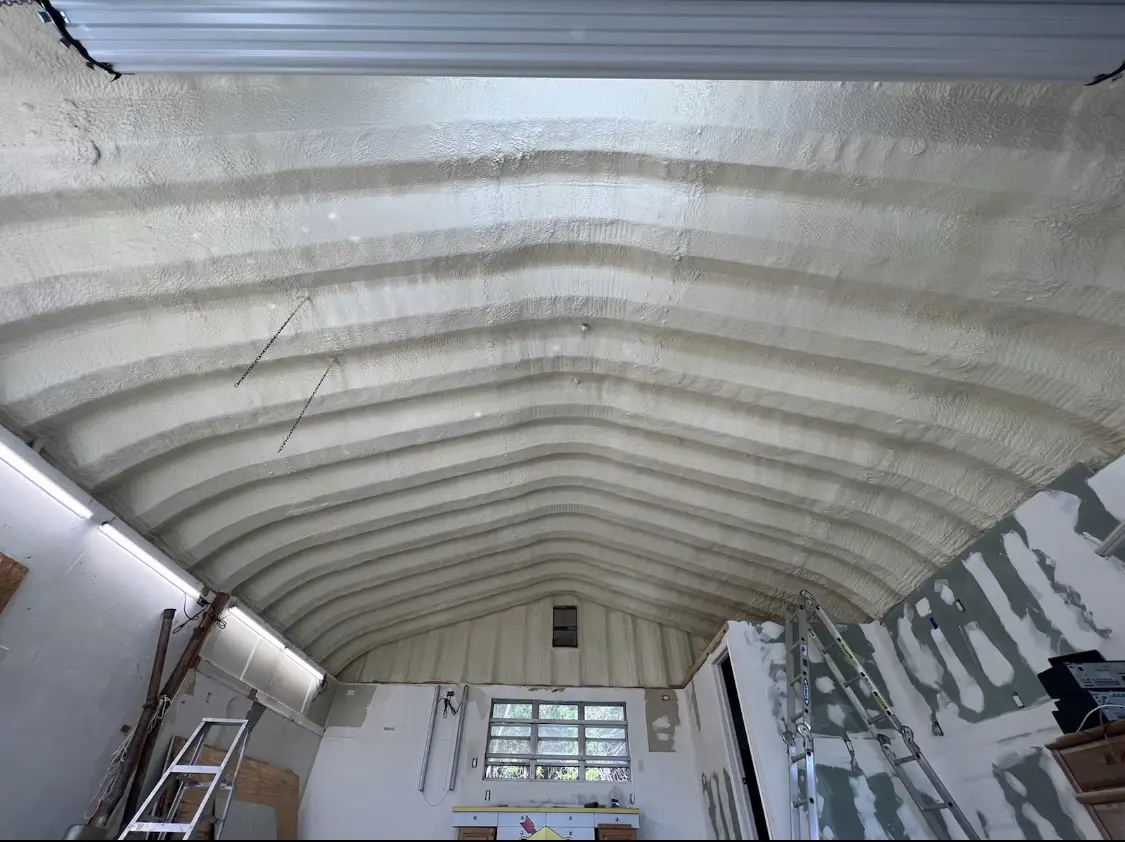 Spray polyurethane foam applied to the underside of a metal roof deck in Uvalde